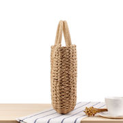 森系シンプル手提げ草編みバッグ純色カジュアル手編みバッグ夏の砂浜写真トランペット